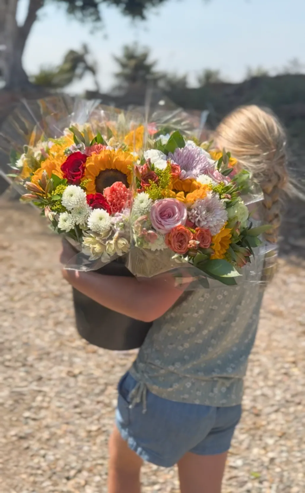 An armful of cut flowers from the field