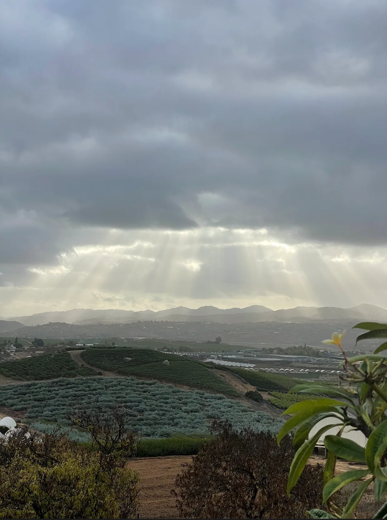 Light breaking through clouds over the valley