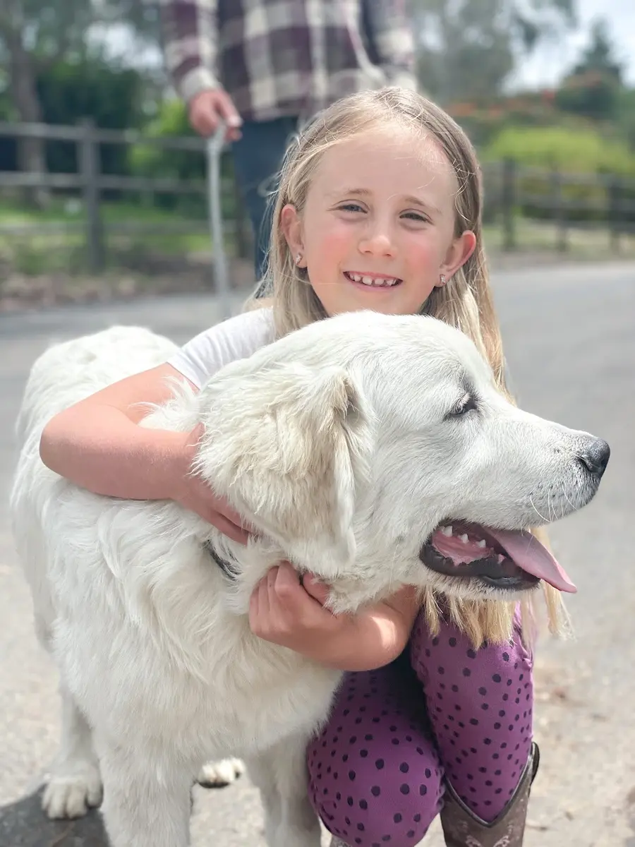 Trooper, the family’s Great Pyrenees puppy, at Tradewinds Ranch